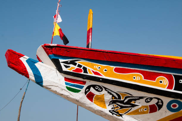 Colorful fishing boats in Tanji, a fishing village in the Gambia, West Africa Colorful fishing boats in Tanji, a fishing village in the Gambia, West Africa banjul stock pictures, royalty-free photos & images