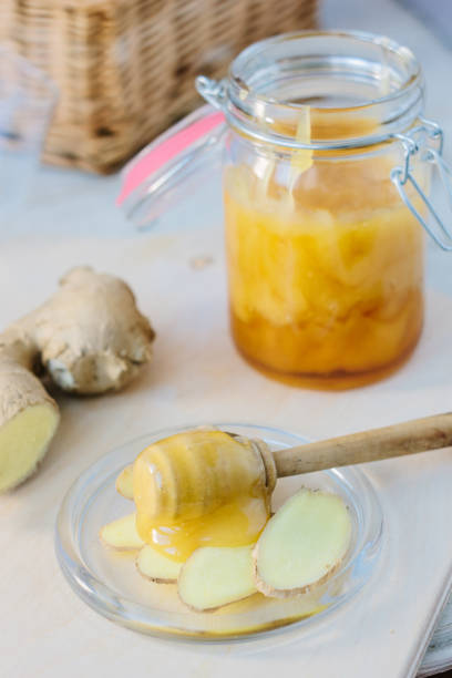 istock Healthy eating - honey and ginger root slices. 655424212