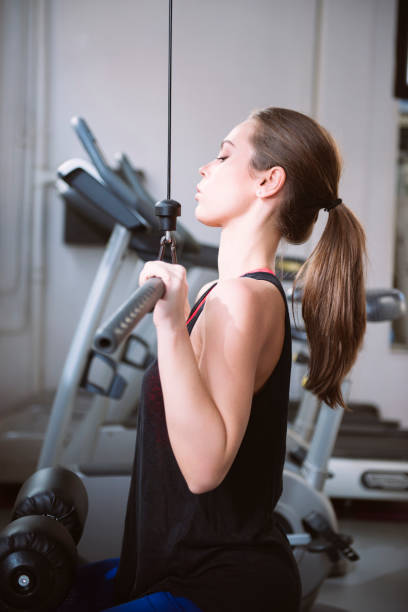 istock Young woman doing exercises in the gym 655442406