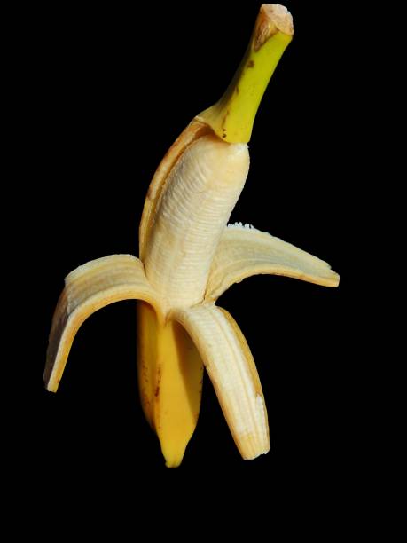 istock open banana isolated on a black background 655443676