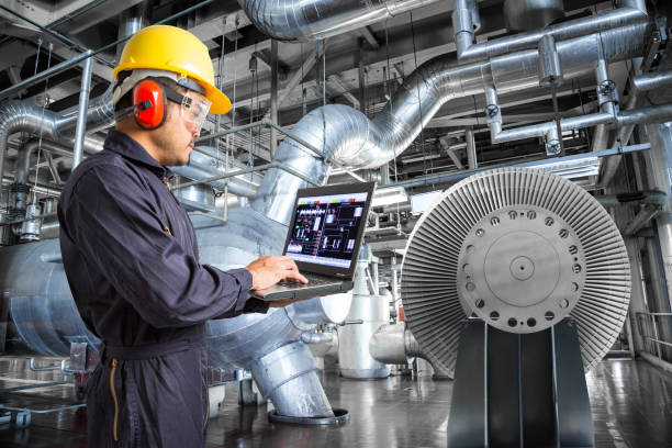 istock Engineer using laptop computer in thermal power plant factory 655443766