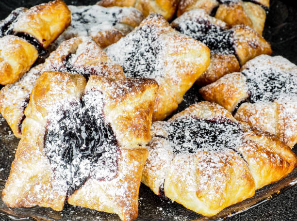 istock Danish pastry with blueberry jam filling with white powdered sugar 655446560