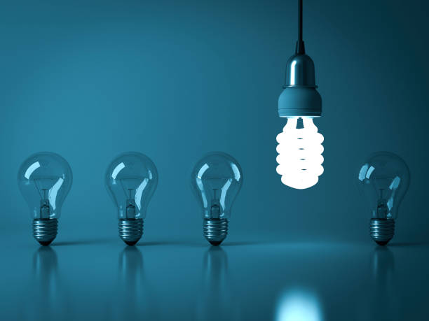 istock One hanging eco energy saving light bulb glowing from the unlit incandescent bulbs with reflection , stand out from the crowd , leadership and different business creative idea concept 3D rendering 655447016