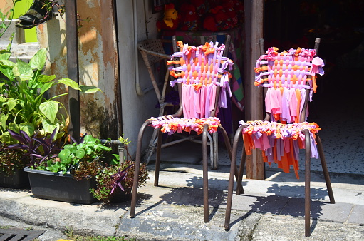 two colorful chairs outside the door