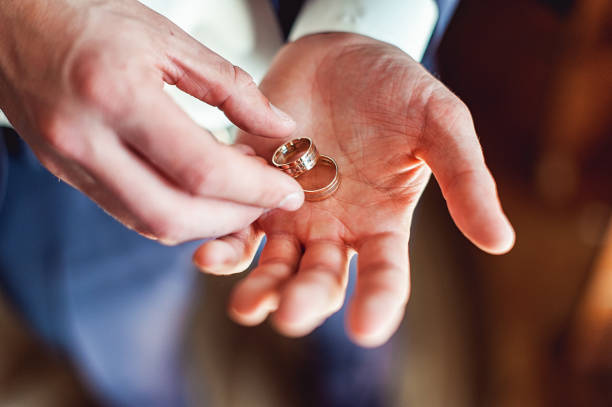 istock luxury wedding rings on the hand of bride 655458214