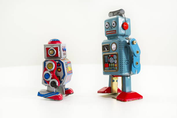 istock Pair of vintage tin toy robots isolated on white background 655458984