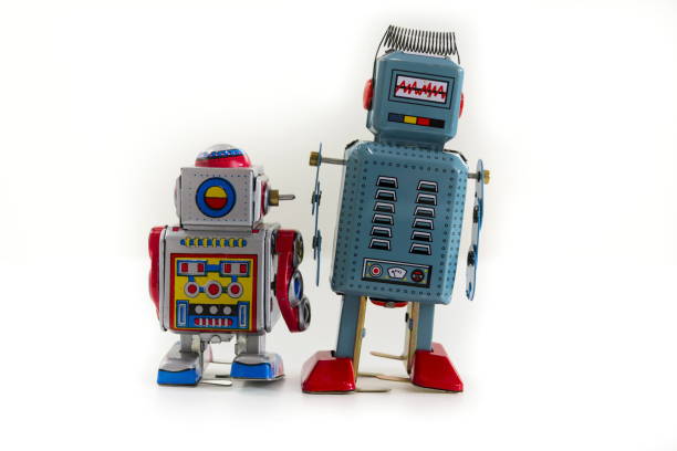 istock Pair of vintage tin toy robots isolated on white background 655459150