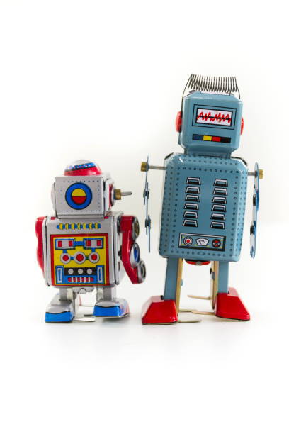 istock Pair of vintage tin toy robots isolated on white background 655459196