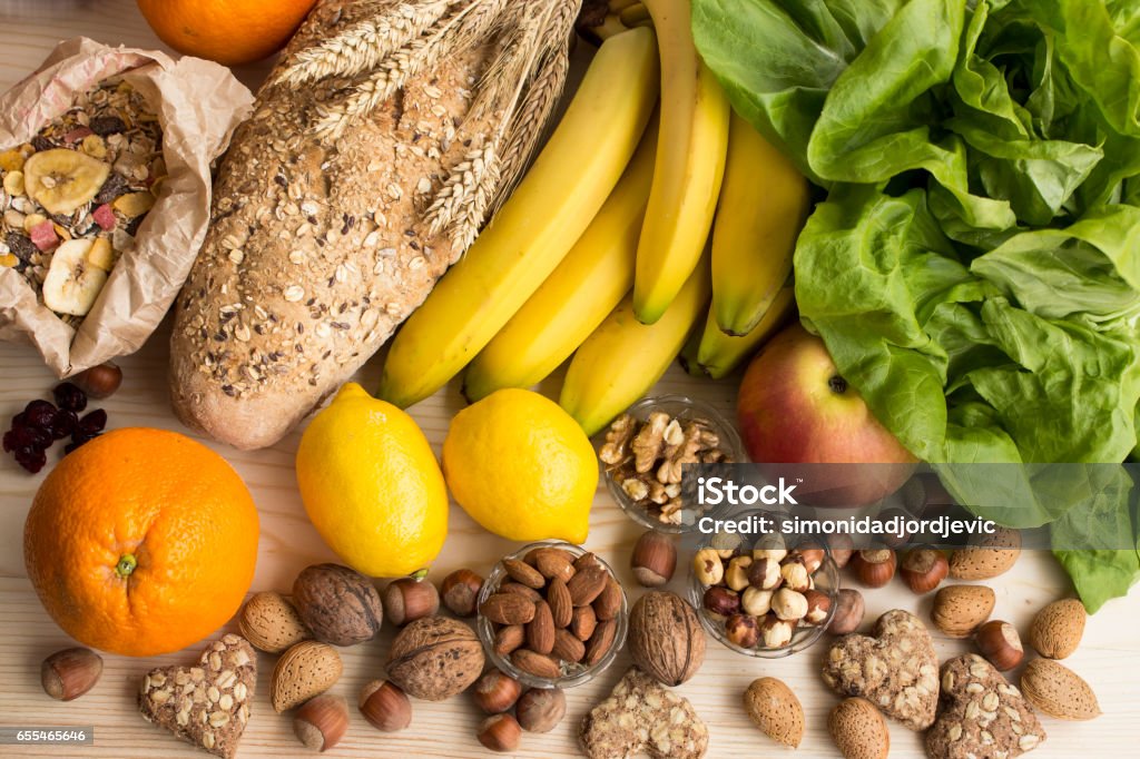 Various Healthy Food Various Healthy Food, Tropical Fruits, Nuts, Muesli, Whole Wheat Bread and Biscuits, Lettuce, Apple. Dietary Fiber Stock Photo