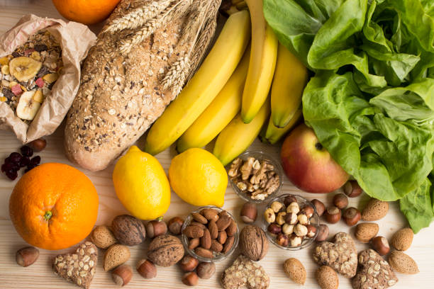 Various Healthy Food Various Healthy Food, Tropical Fruits, Nuts, Muesli, Whole Wheat Bread and Biscuits, Lettuce, Apple. dietary fiber photos stock pictures, royalty-free photos & images