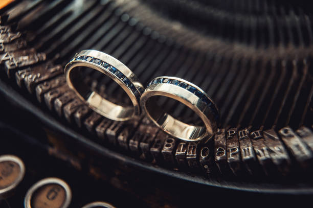 istock Wedding rings with sapphires on a vintage typewriter 655465760