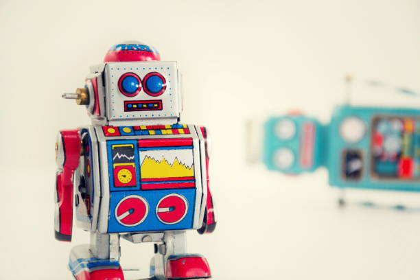 istock Filtered vintage tin toy robots isolated on white background 655468994