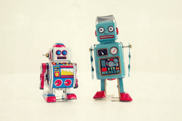 istock Filtered vintage tin toy robots isolated on white background 655469212