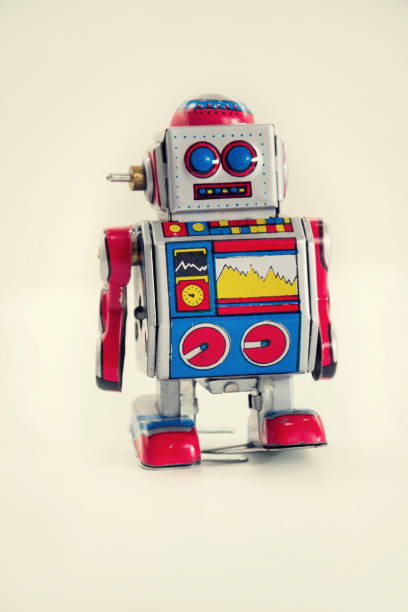 istock Filtered vintage tin toy robot isolated on white background 655469360