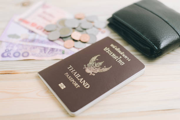 istock Thailand passport and Thai money 655471394