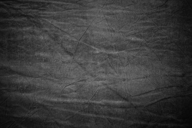 istock Texture of dark grey crumpled fabric 655472010