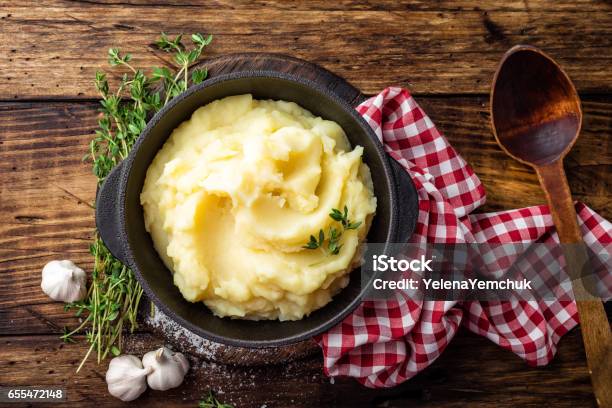 Mashed Potatoes Boiled Puree In Cast Iron Pot On Dark Wooden Rustic Background Top View Stock Photo - Download Image Now