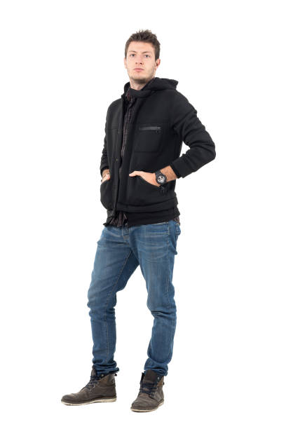 istock Serious confident male model in black hooded jacket with hands in pockets 655475018