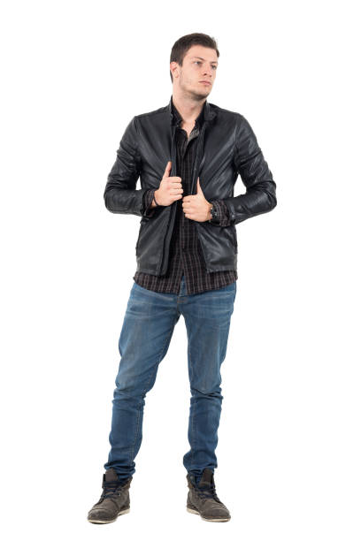 istock Young handsome man in jeans wearing black leather jacket looking away 655475568