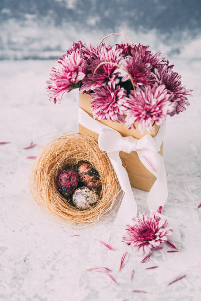 istock The beautiful purple spring flowers with Easter eggs  on vintage background 655484756