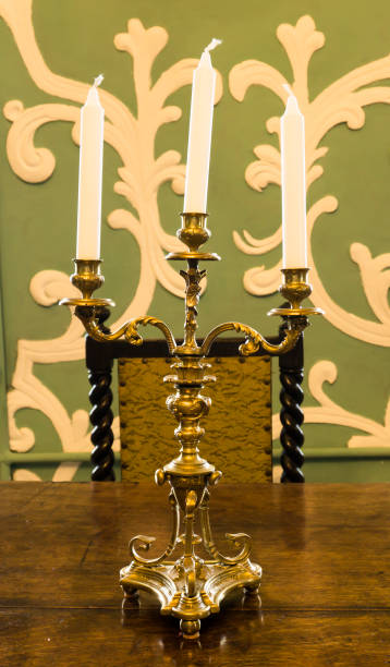 istock Gold candlestick with candles on the table 655485886