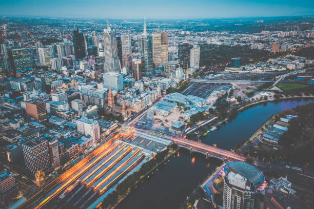 Cityscape of Melbourne at Sunset, Australia Cityscape of the city of Melbourne at Sunset, Australia clear sky night sunset riverbank stock pictures, royalty-free photos & images