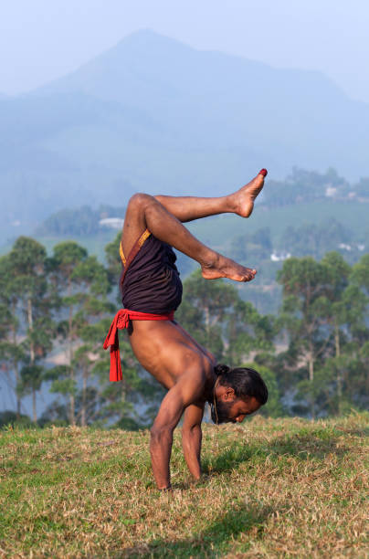istock Indian man doing handstand exercise outdoors 655488612