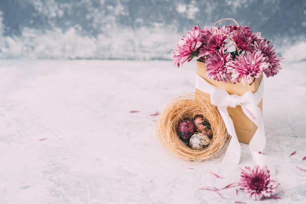 istock The beautiful purple spring flowers with Easter eggs  on vintage background 655493574