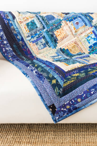 istock The colored patchwork quilt with blue geometry pattern. Part of Colorful Scrappy blanket 655494404