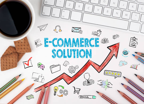 istock E-Commerce Solution, Business Concept. Computer keyboard and cup of coffee on a white table 655499762
