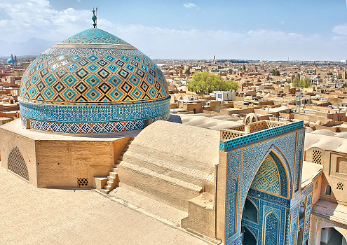 Itchan Kala Khiva City Uzbekistan Drone View over Khiva - Xiva - Хива, famous City along the Silk Road with majestic the Itchan Kala, Mohammed Rakhim Khan Madrassah Islamic School Complex and the Islam Khoja Minaret in the background. Colourful Sunset Twilght over the Madressa Complex in Itchan Kala, Khiva - Chiva, Xorazm Region, Uzbekistan, Central Asia