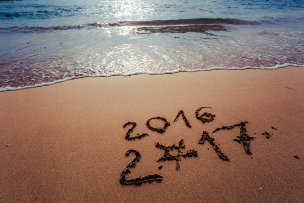 istock Happy New Year 2017 on the beach 655503606