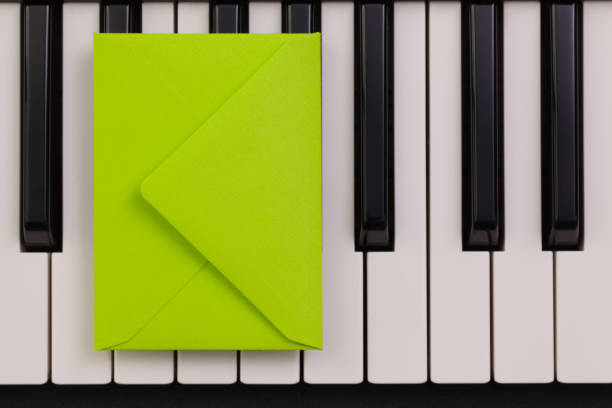 istock Funny arrangement envelope on the piano keybords 655503624