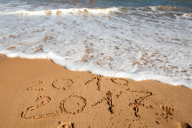 istock Happy New Year 2017 on the beach 655503646