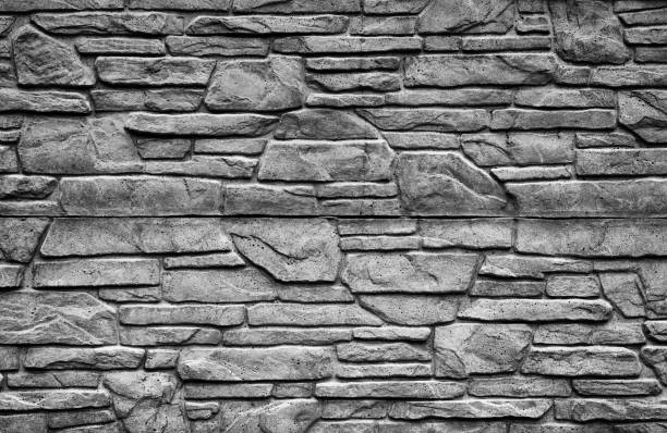 istock Black and white stone brick wall detailed contrast texture background 655509572