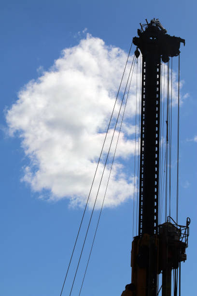 istock Crane silhouette against blue sky 655513440