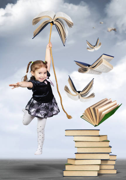 istock Education creative concept , child girl fly on book 655523010
