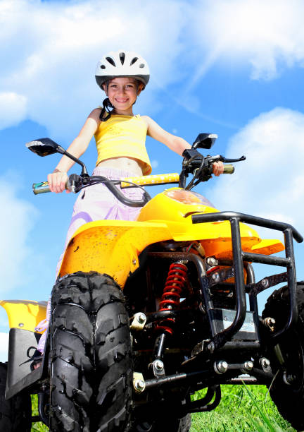 istock Little Child girl rides on quad 655523270