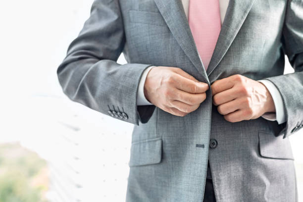 istock Midsection of mature businessman buttoning his blazer 655532274