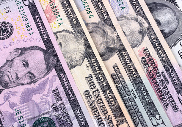 istock Abstract dollar bills of different denominations background. 655537196