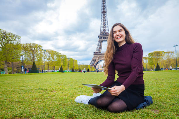 istock Happy young woman enjoying Paris 655551878