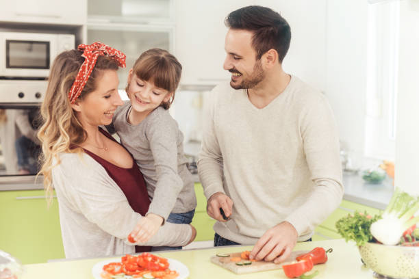 istock Happy young family in kitchen 655555268
