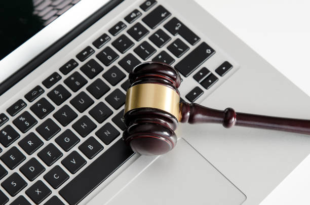 istock Wooden gavel on laptop keyboard 655561184