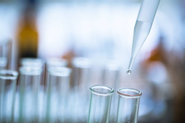 istock Liquid drop from laboratory glass pipette to test tube 655563390