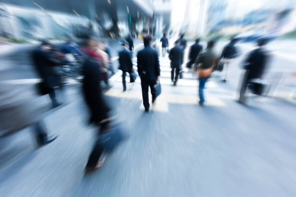 istock Crowds of Commuters Walking Through the Crosswalk Busily 655575076