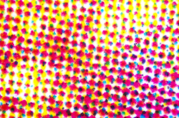 Four color printing on paper under microscope Four color printing on white paper under the microscope. CMYK Cyan Magenta Yellow and Key or black color process. Subtractive color mixing. Synthesis with primary and secondary colors. Photo. secondary colors stock pictures, royalty-free photos & images