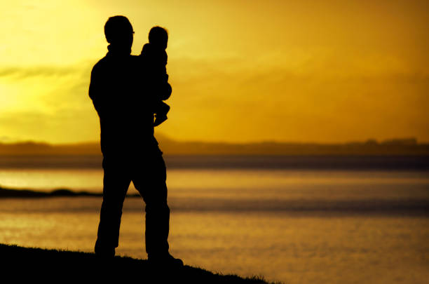 istock Young father carries his child 655590698