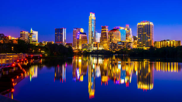 istock Nightscape Long Exposure Austin Texas perfect glass mirrored Image of Downtown Skyline 655590720