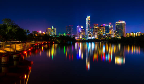 istock Night Scene Austin Texas Downtown Reflection off Colorado River wide Angle 655593238