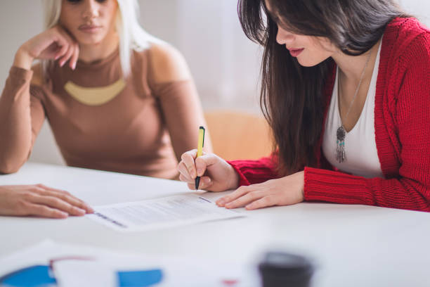 istock Woman signing contract 655593792